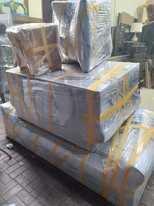 Furniture wrapped and taped, stacked for the move