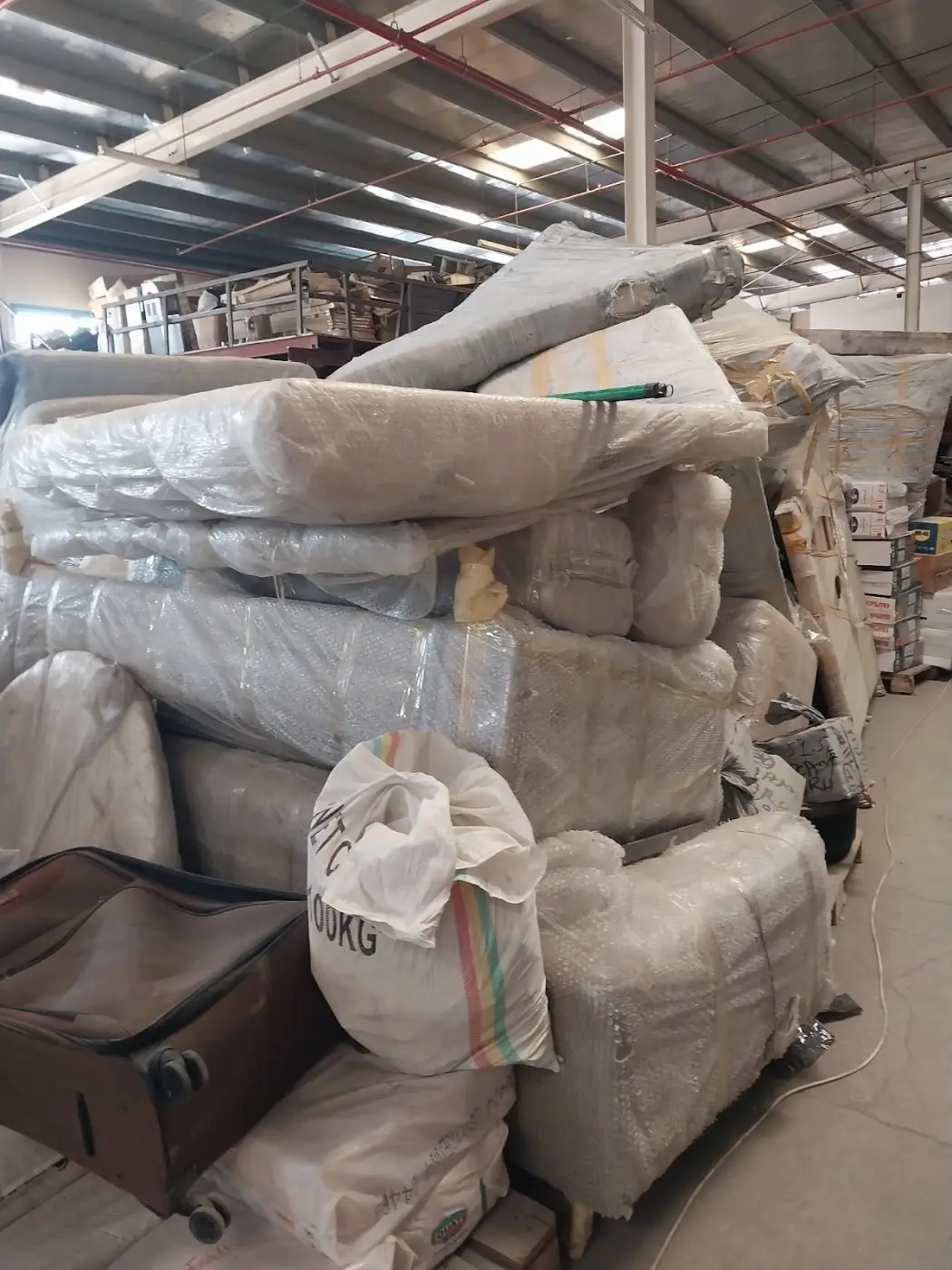 Wrapped sofas lined up for loading